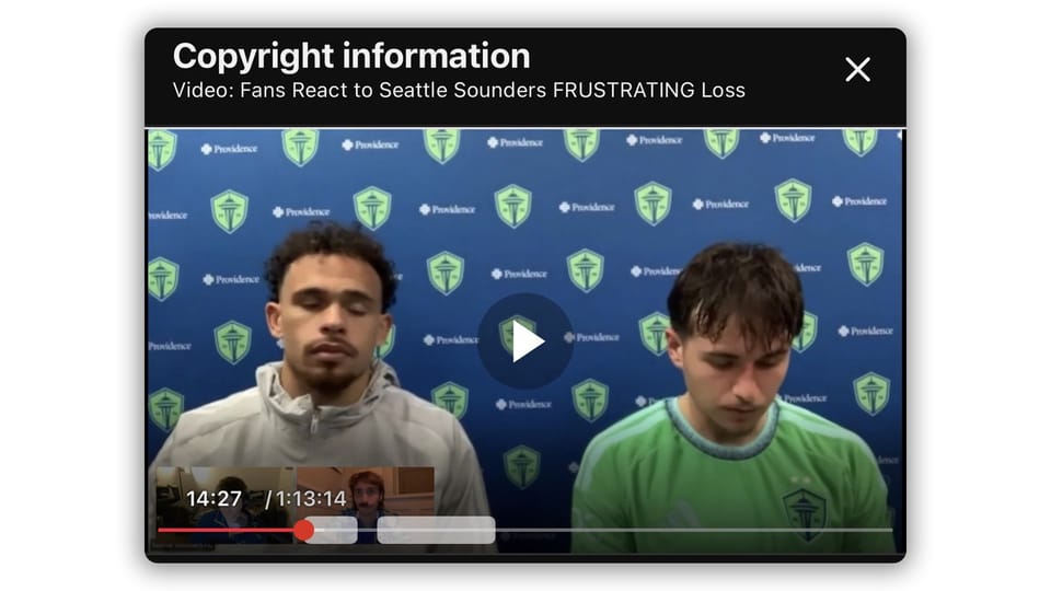 YouTube copyright information notice overlaying a video showing Seattle Sounders players Hassani Dotson (left) and Snyder Brunell (right) seated at a post-match press conference.